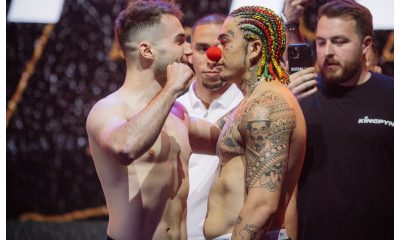 Com tranças coloridas e um nariz de palhaço, comediante brasileiro debocha das provocações do rival