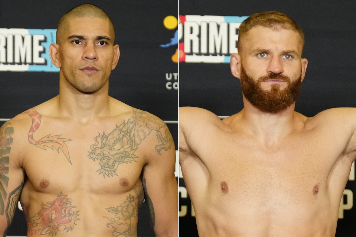 Alex Poatan e Jan Blachowicz posam para fotos após se pesarem para o UFC 291