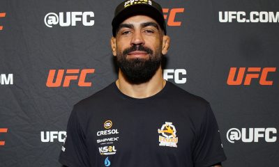 De boné, Elizeu Capoeira posa para foto no media day do UFC Vegas 108