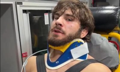 Georgio Poullas com colar cervical após ser agredido por Arman Tsarukyan no RAF 6