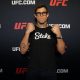 De punhos cerrados, Caio Borralho posa para foto no media day do UFC 326