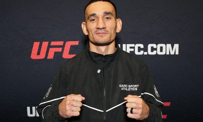 De punhos cerrados, Max Holloway posa para foto no media day do UFC 326