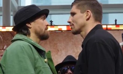 Oleksandr Usyk (à esquerda) e Rico Verhoeven ficaram mais de dois minutos se encarando