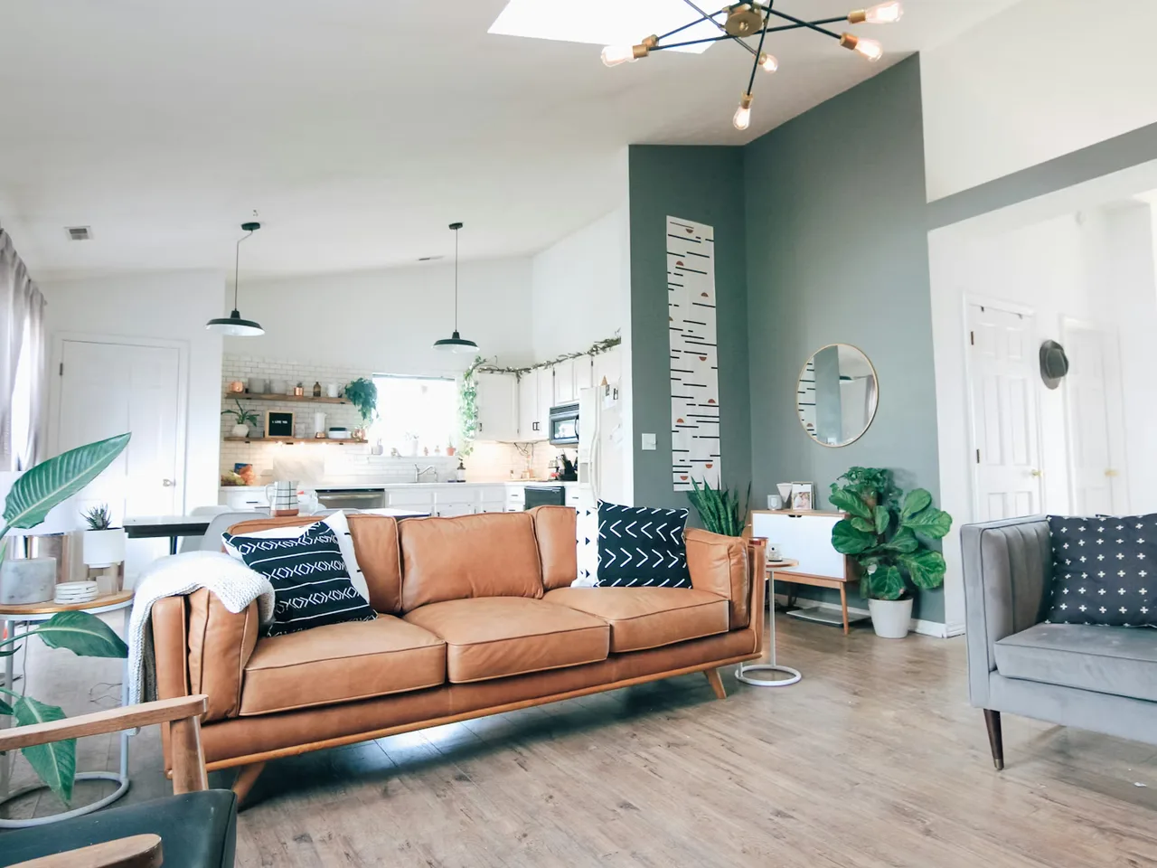 Two-storey clubhouse with glass facade and landscaped entrance plaza
