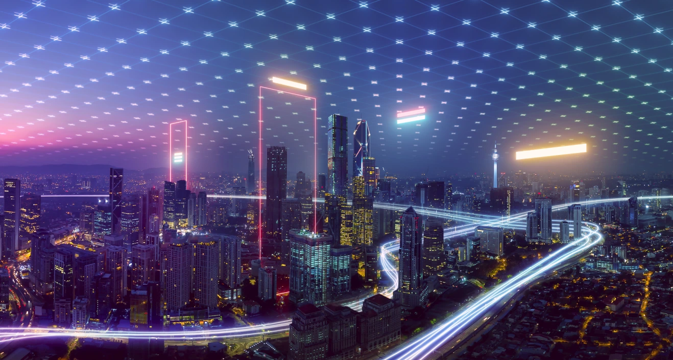 Städtische Infrastruktur Die Skyline einer Stadt in der Nacht.