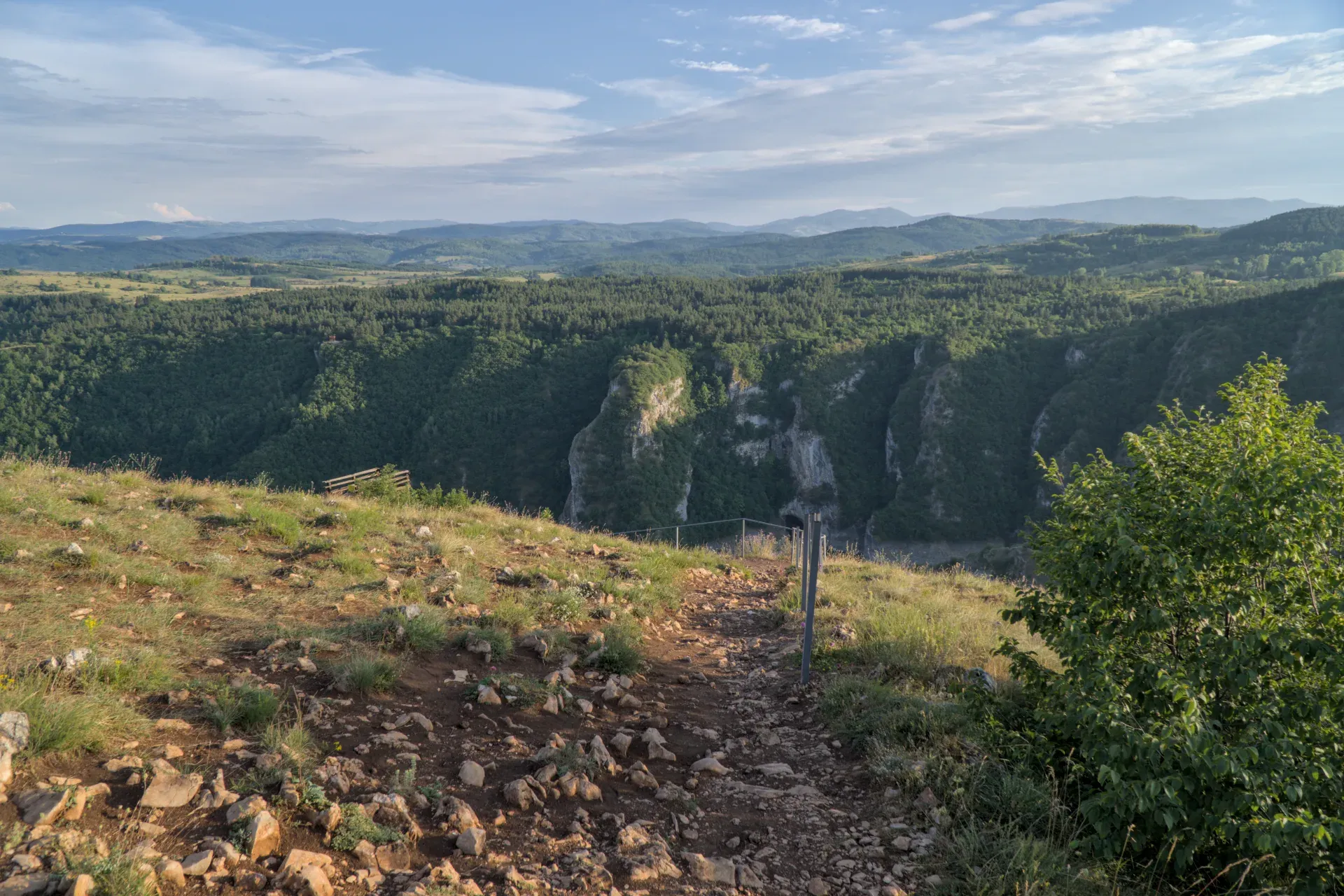 View from the "Prayer" viewpoint over the Uvac Canyon in Serbia, with forests and slopes.
