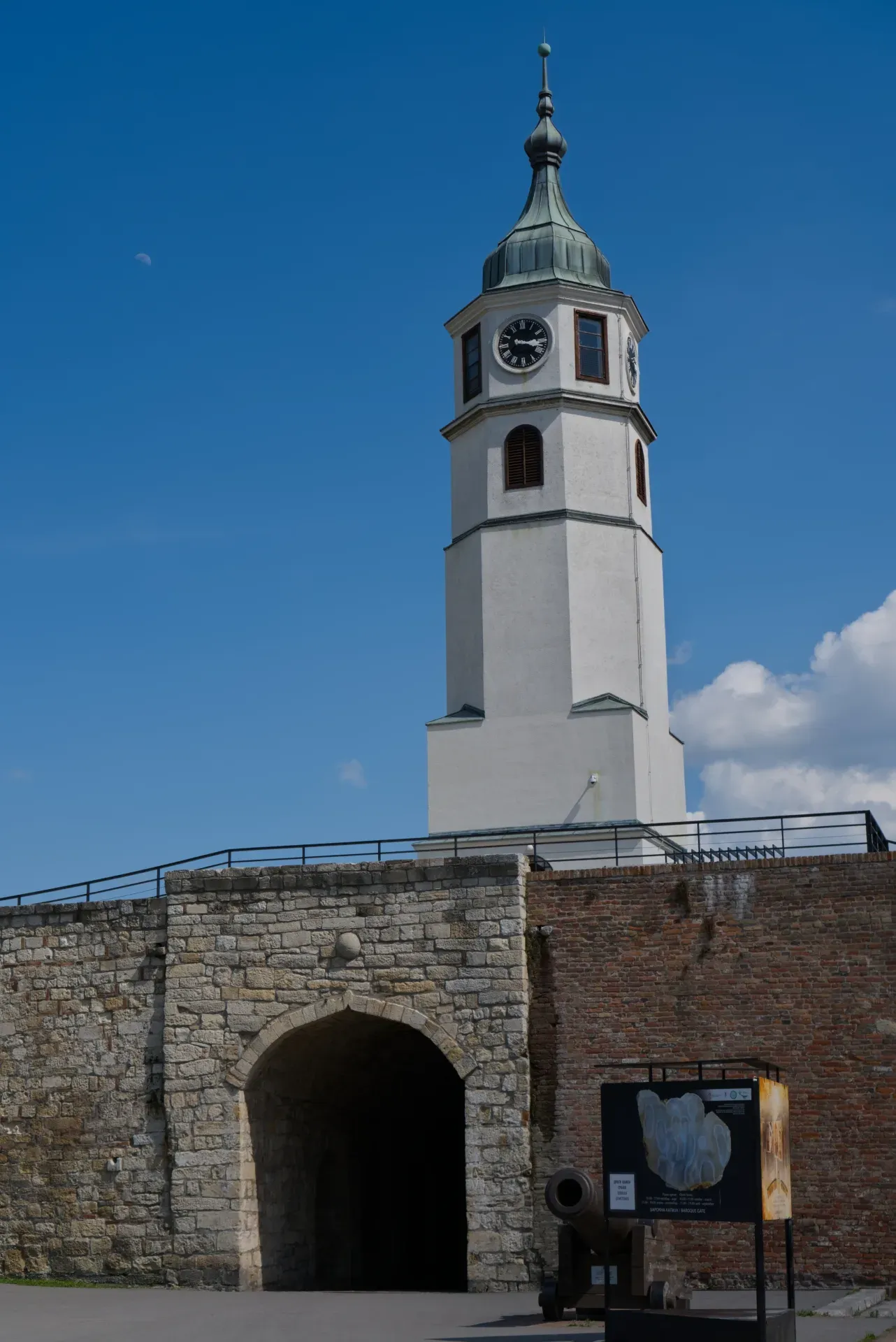 Clock tower of Kalemegdan Fortress in Belgrade against a blue sky.