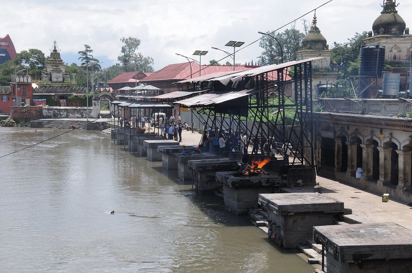 A Nepali city struggles to handle the many bodies on its riverbanks.