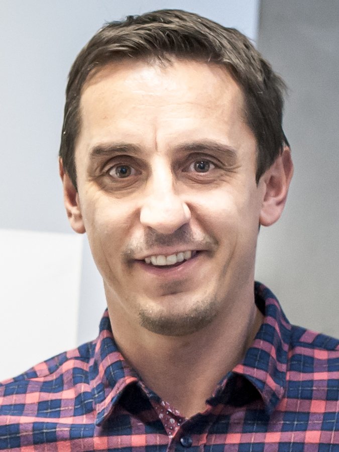 Wide-legged trousers for men are having a moment. Just ask Gary Neville