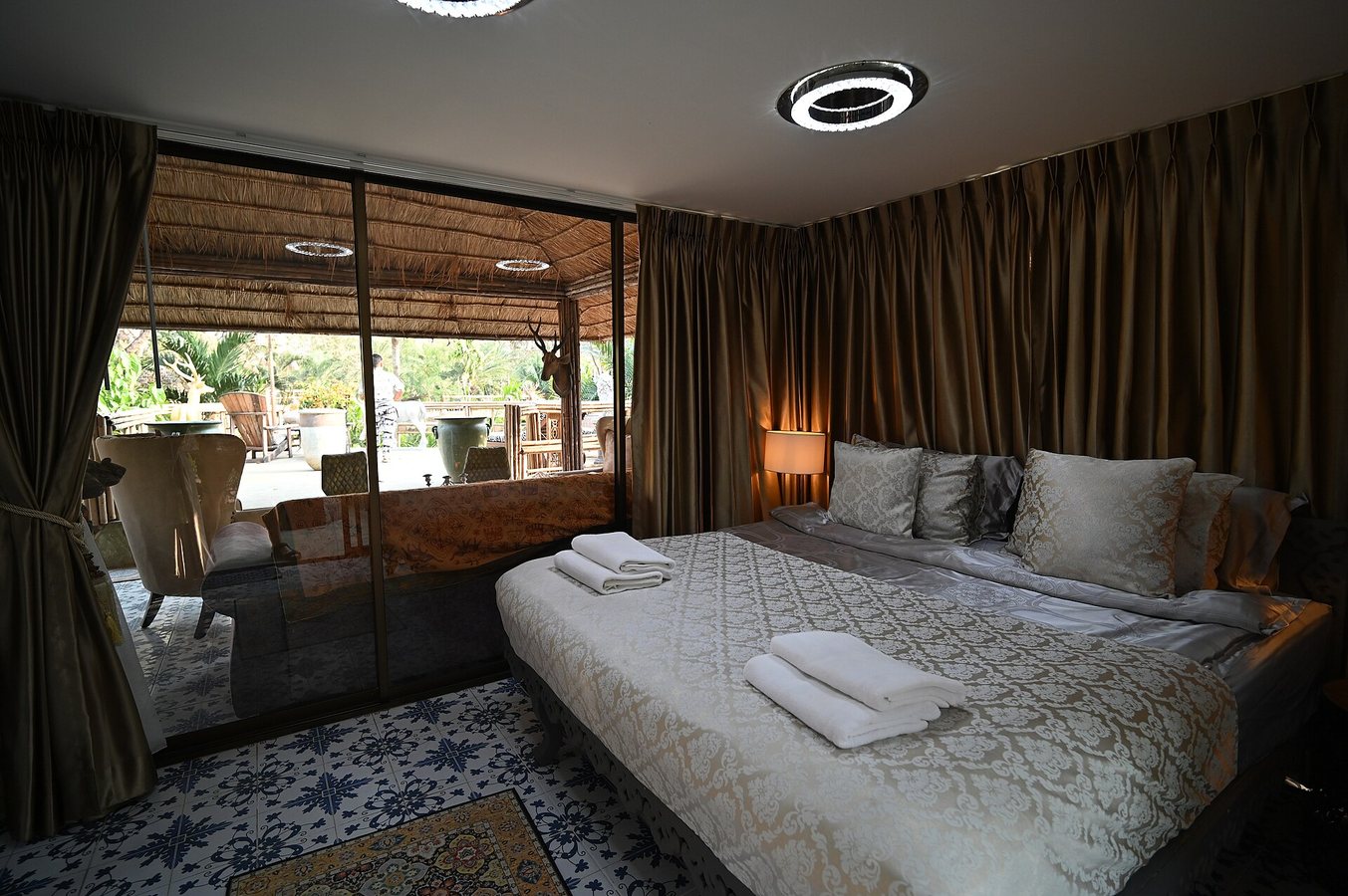 rima dain frames exterior living zones with custom architectural outdoor rugs