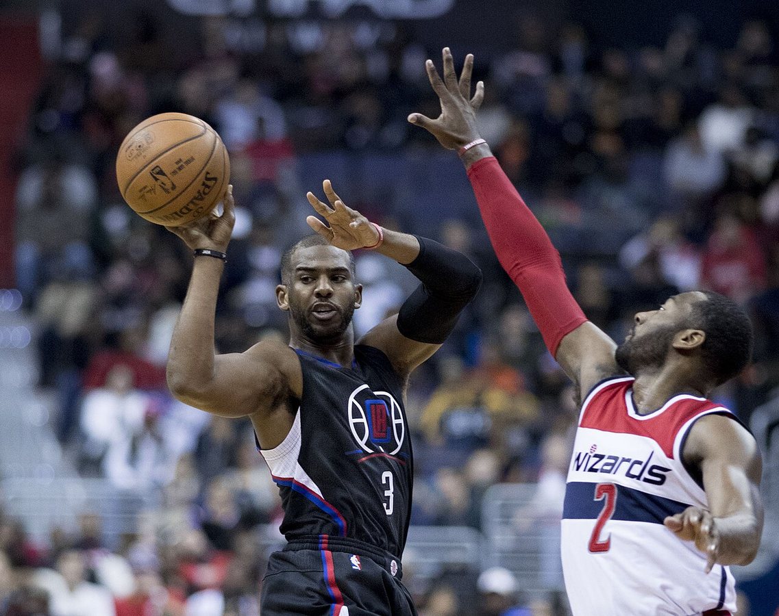 Chris Paul of the Los Angeles Clippers, left, passes to a teammate