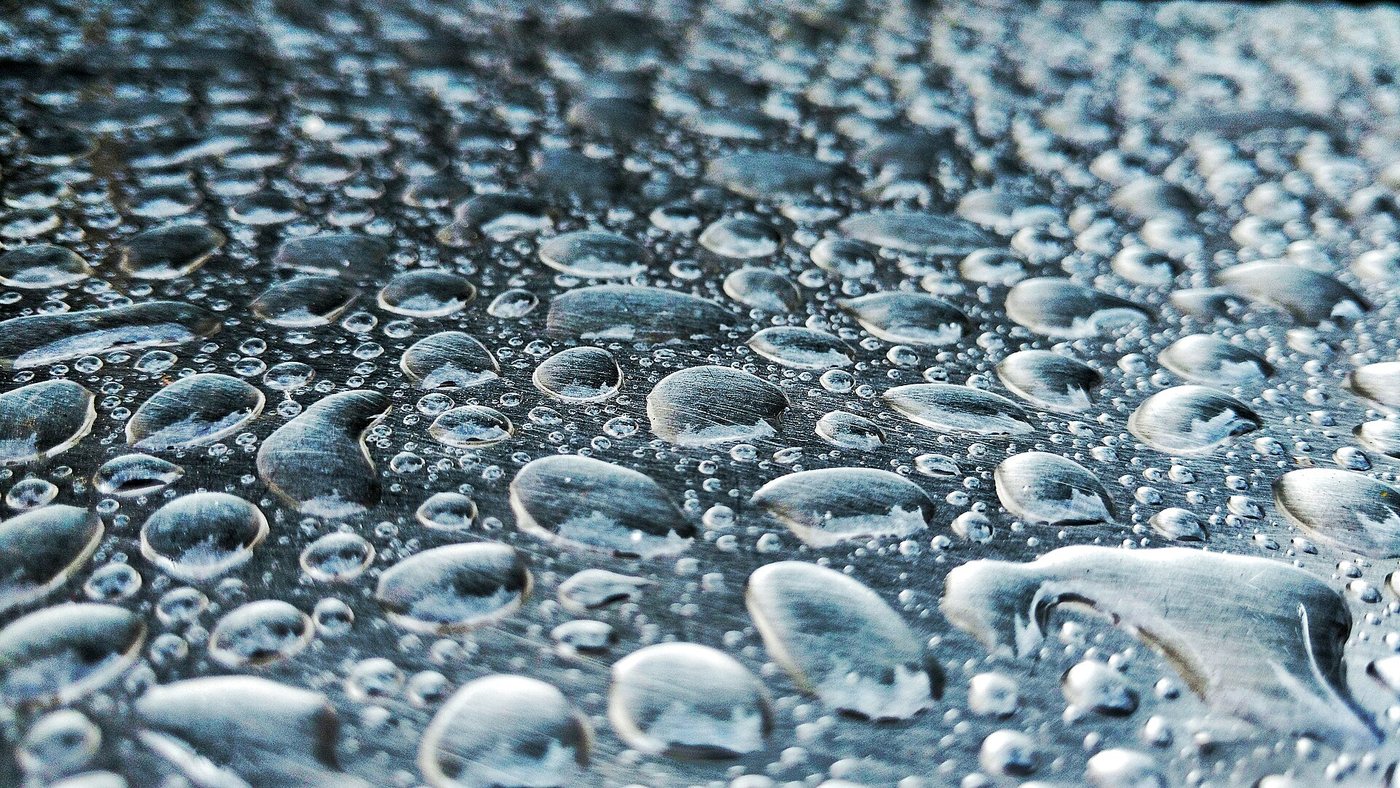 Sliding water droplets corrode Teflon-coated metal