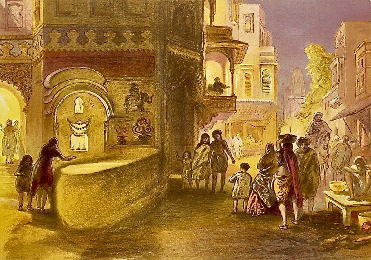 Chromolitografia Williama Simpsona z 1867 roku zatytułowana „Dewali, święto lamp”, przedstawiająca oświetlone ulice o zmierzchu oraz dziewczynkę i jej matkę zapalające lampę na rogu ulicy