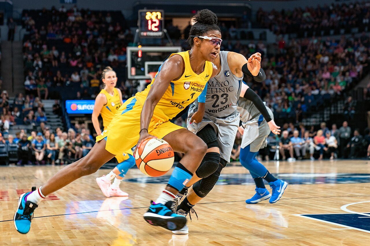 Diamond DeShields (#1) drives to the basket around Maya Moore (#23) in the Minnesota Lynx versus Chicago Sky game