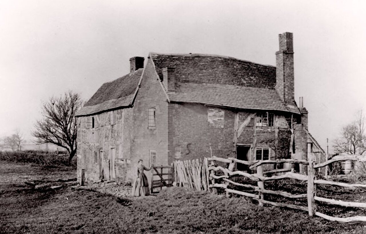 Il 'Dog Yard', ritenuto la casa d'infanzia di George Fox, fotografato intorno al 1890 prima della sua demolizione