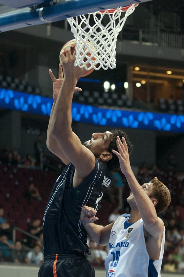 Singh (left) with the Indian national team in 2013 scoring a right-sided layup