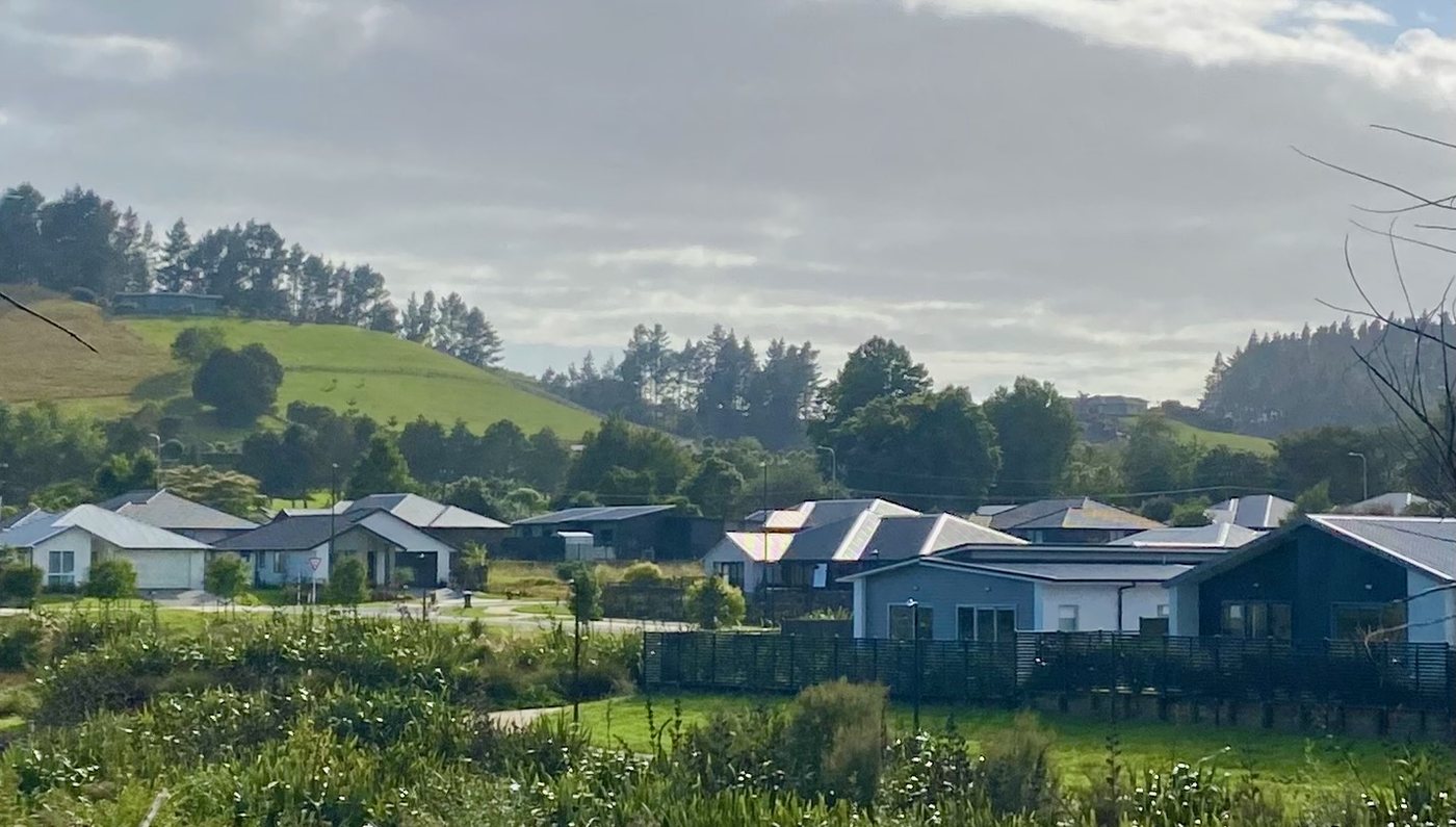 Government hands over 16 new homes in Woodford Hill, with titles to follow