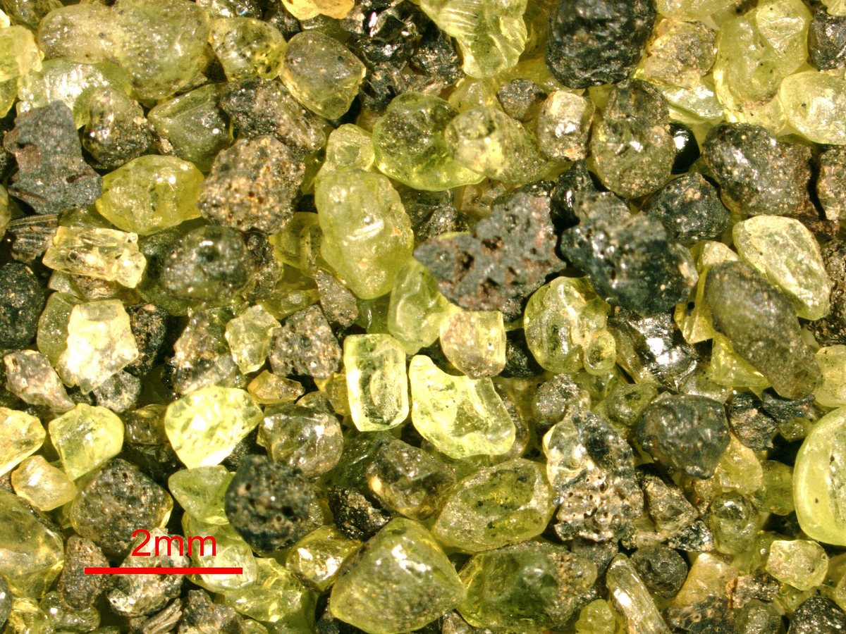 Olivine-basalt sand (marine beach sand, modern; Green Sand Beach, Puu Mahana Volcanic Cone, southern tip of Hawaii, central Pacific Ocean) 2 (14849882930).jpg