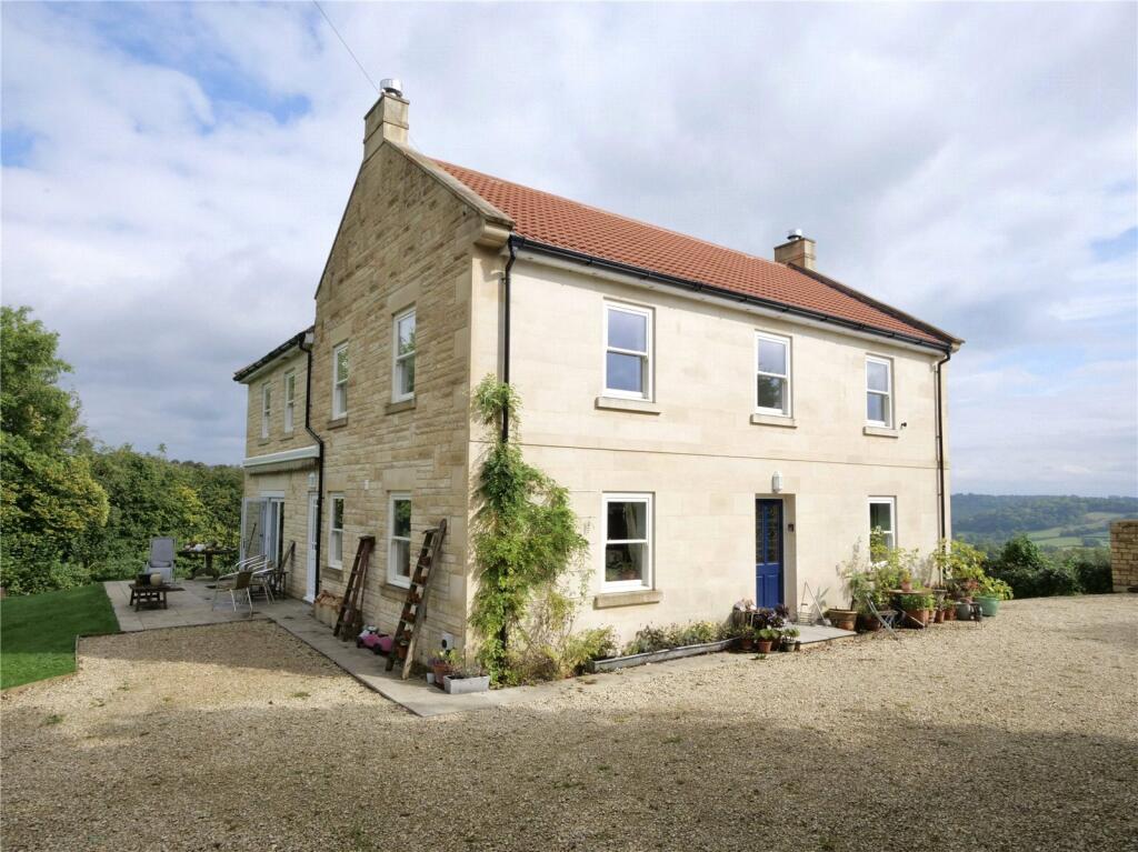 An attractive recently constructed three-bedroom farmhouse