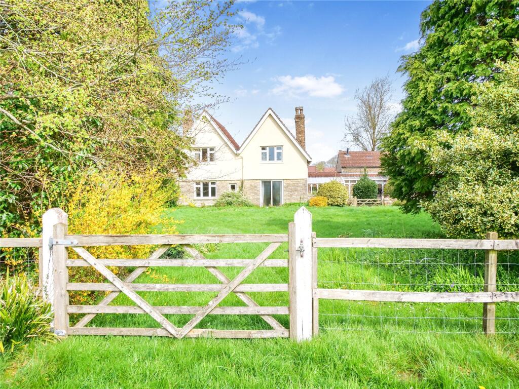 Four bedroom house with adjoining barns, outbuildings & two paddocks (3.92 acres.)