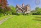 0.91 Acres | 2,725 Sq. Ft. | Five Outbuildings | 10+ Car Parking