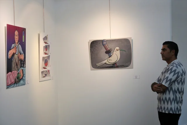 Tahran'da 'Suç Senfonisi' Karikatür Sergisi Açıldı