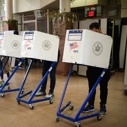 A line of voting booths at a polling station in Queens, New York
