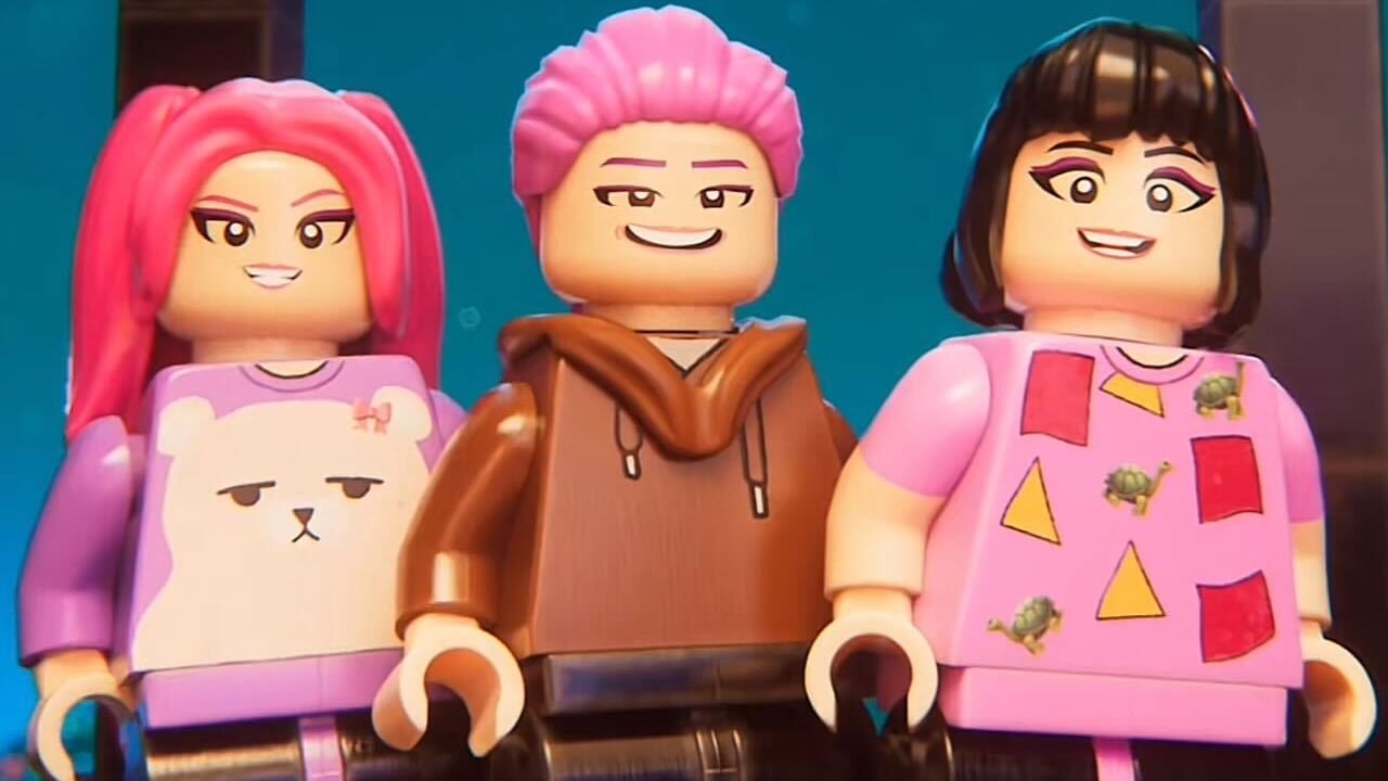 Lego version of Huntr/x smiling at something off-screen.