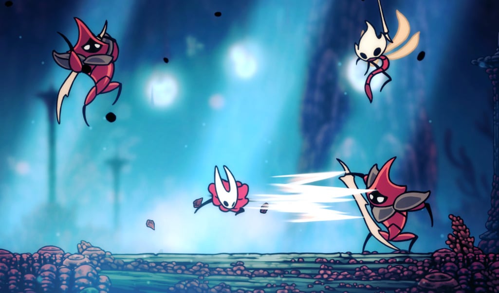 Hornet fights enemies in a blue cavern.