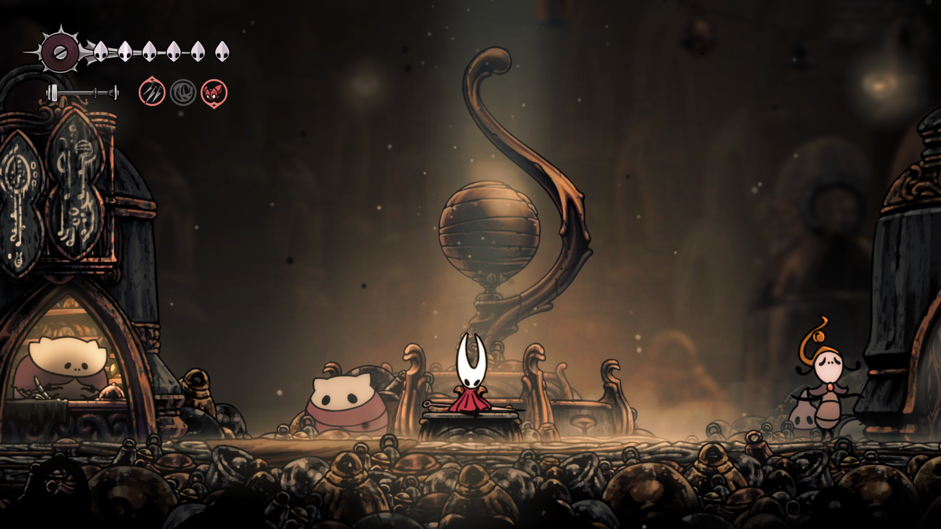 Hornet takes a break in the restored town of Bellhart in Hollow Knight: Silksong.