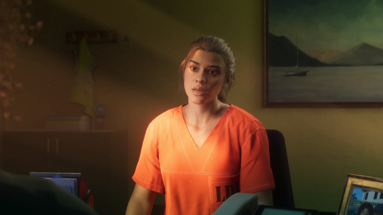 Stefanie askes Lucia if she knows why she’s here, which suggests that the game may open with Lucia commiting a crime and then being sent to the LDC. The key art shows Lucia wearing an electronic tag on her ankle, and so it seems likely that the majority of GTA 6 will take place after she has been released on probation.