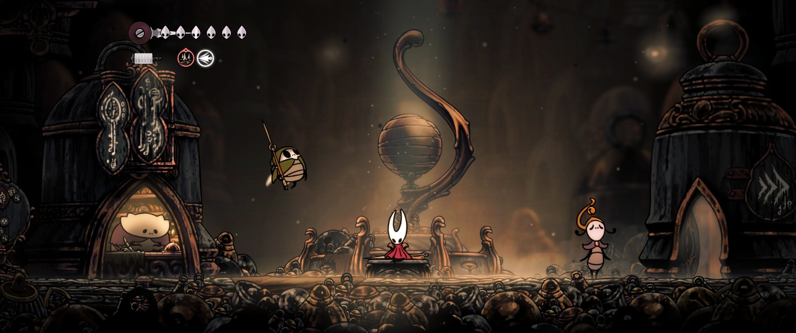 Hornet sits on a bench with some friendly bugs scattered around nearby, in Hollow Knight: Silksong running at 21:9 ultrawide.