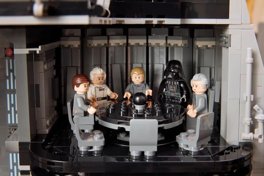 Darth Vader meeting with Moff Tarkin and Imperial leadership in the Conference Room.