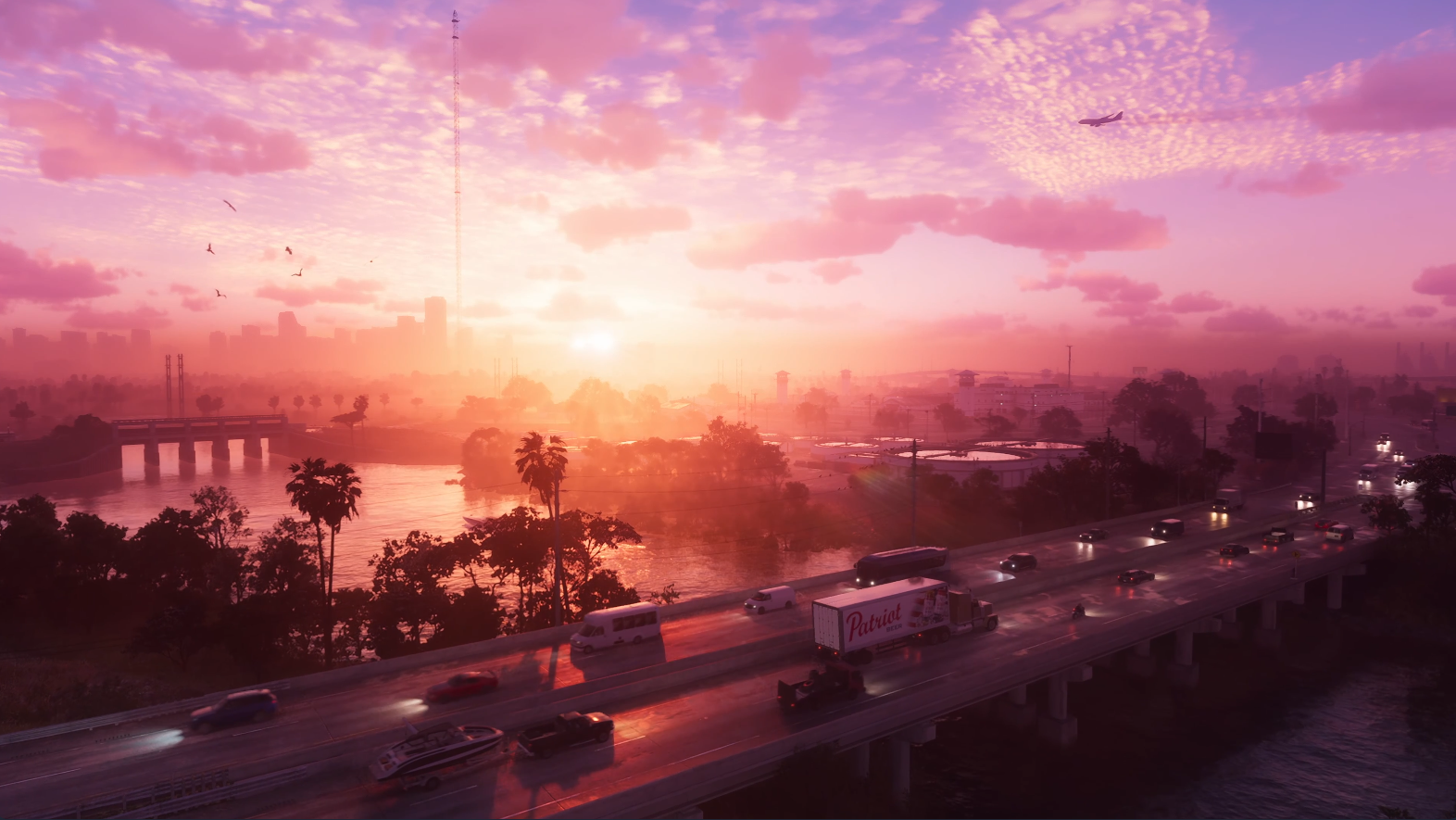 The trailer’s opening shot is pure Florida, the colours of the setting sun evoking the ‘Save the Date’ Tweet that Rockstar put out ahead of the trailer. You can even see the birds and the palm trees. The traffic on the road in the foreground includes a variety of GTA staples, including trucks, RVs, boats, and motorbikes. And on the side of a semi we can see the branding for Patriot, the beer that first appeared in Grand Theft Auto 4. Off in the distance we can see an incredibly tall broadcast mast, based on the real WTVY TV Tower. Fun fact: This is the highest point in all of Florida. We can only hope that we will be able to climb to the top and base jump from it.