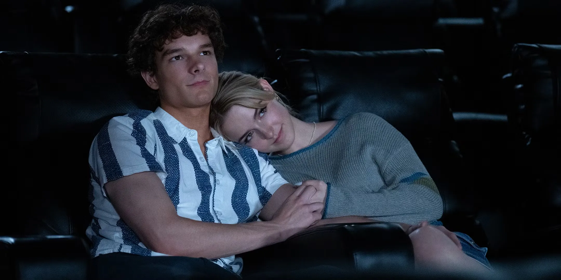 Mason Thames' Miller and Mckenna Grace's Clara cuddling while in a movie theater in Regretting You