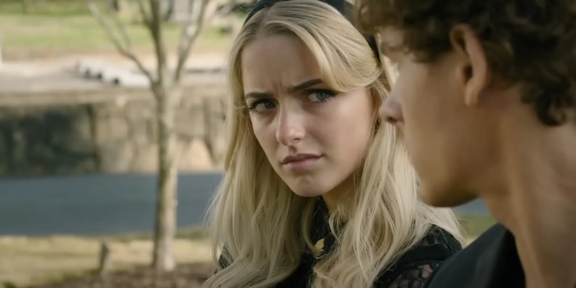 Mckenna grace looks over at Mason Thames in the trailer for Regretting You