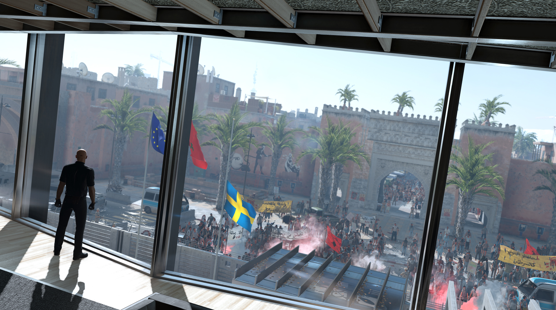 Agent 47 looks out a window in Marrakesh in Hitman 2016