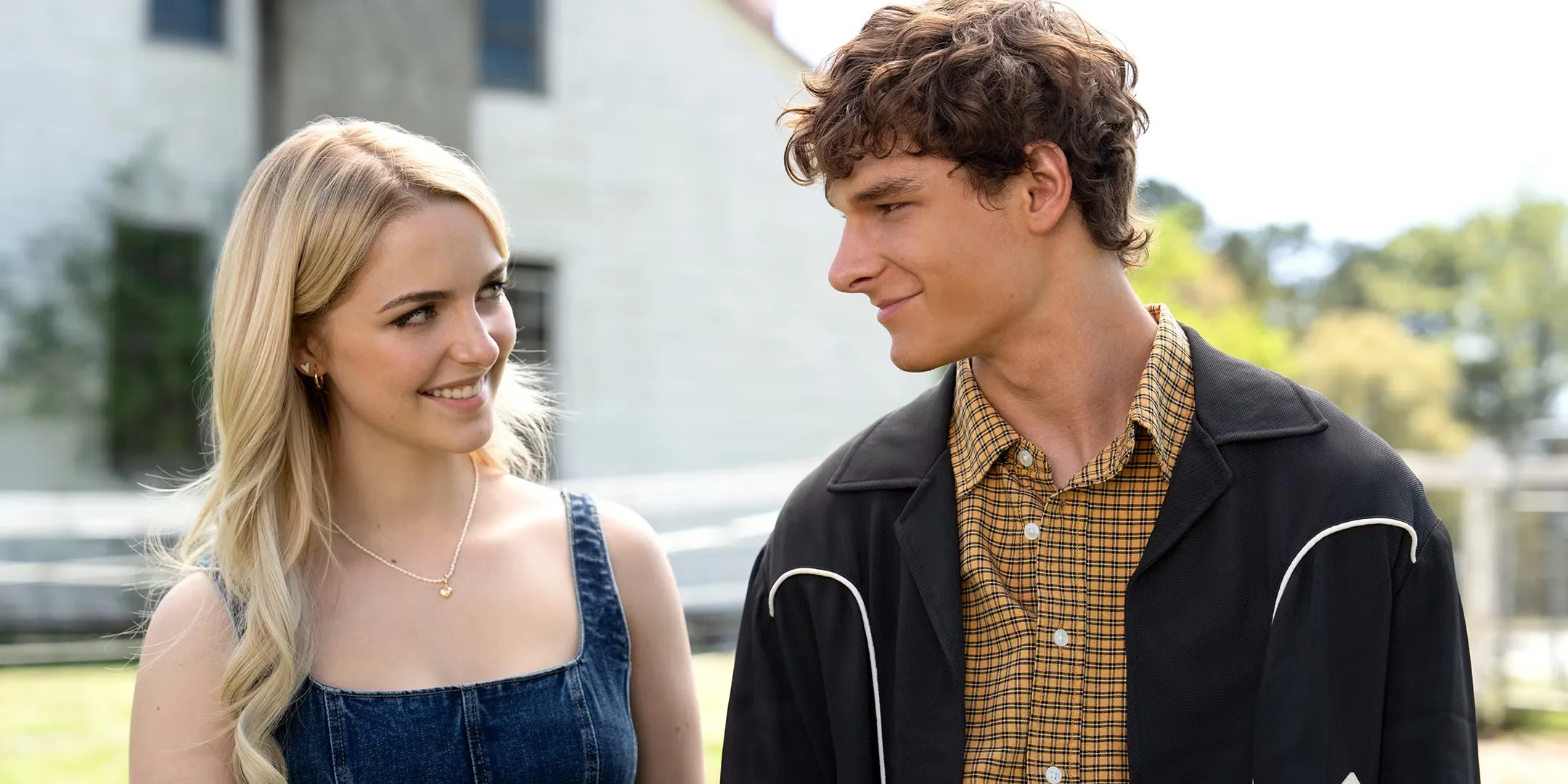 Mckenna Grace's Clara and Mason Thames' Miller smiling at each other in Regretting You
