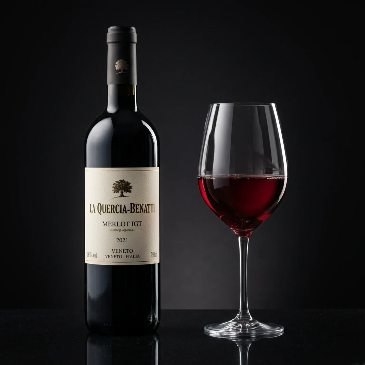 A professional beverage photograph of a bottle of Merlot IGT La Quercia-Benatti red wine alongside a filled red wine glass