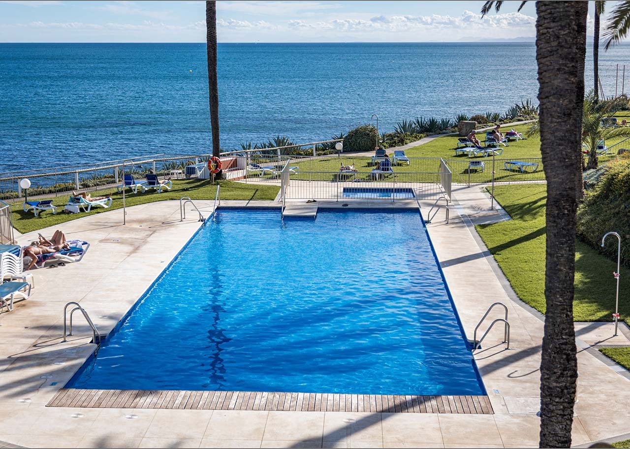 Main pool area at Costa Natura with sun loungers