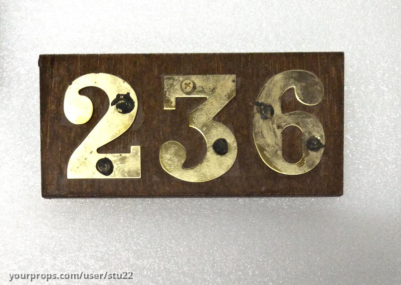 Hotel Room Door Plaque – The Portable Door (2023) – image 1