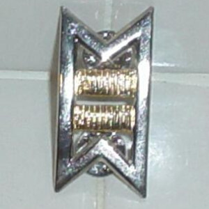 commander rank pin. – Star Trek II: The Wrath of Khan (1982)