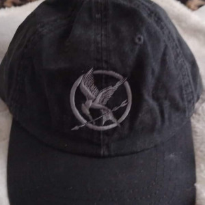 Mocking Jay crew cap Prop/ Weapons dept – The Hunger Games: Mockingjay - Part 2 (2015)