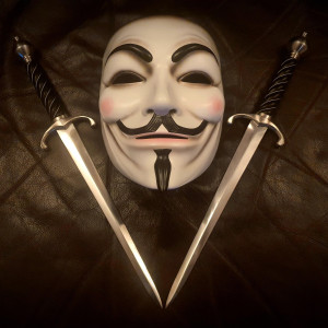'V' mask & daggers. – V for Vendetta (2005)