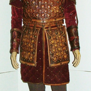 screen worn "Alfred the Great" long sleeve red tunic with Leather Armor leather boot covers & Cuffs – Vikings (2013)
