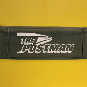 chair back – The Postman (1997)