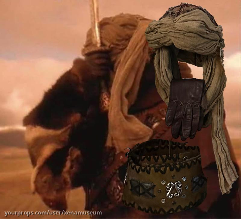 Riding turban, gloves, belt, continuity photo from The Debt – Xena: Warrior Princess (1995) – image 1